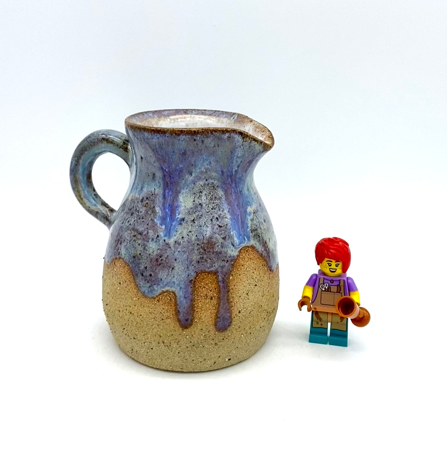 Little jug in purples and toasty clay