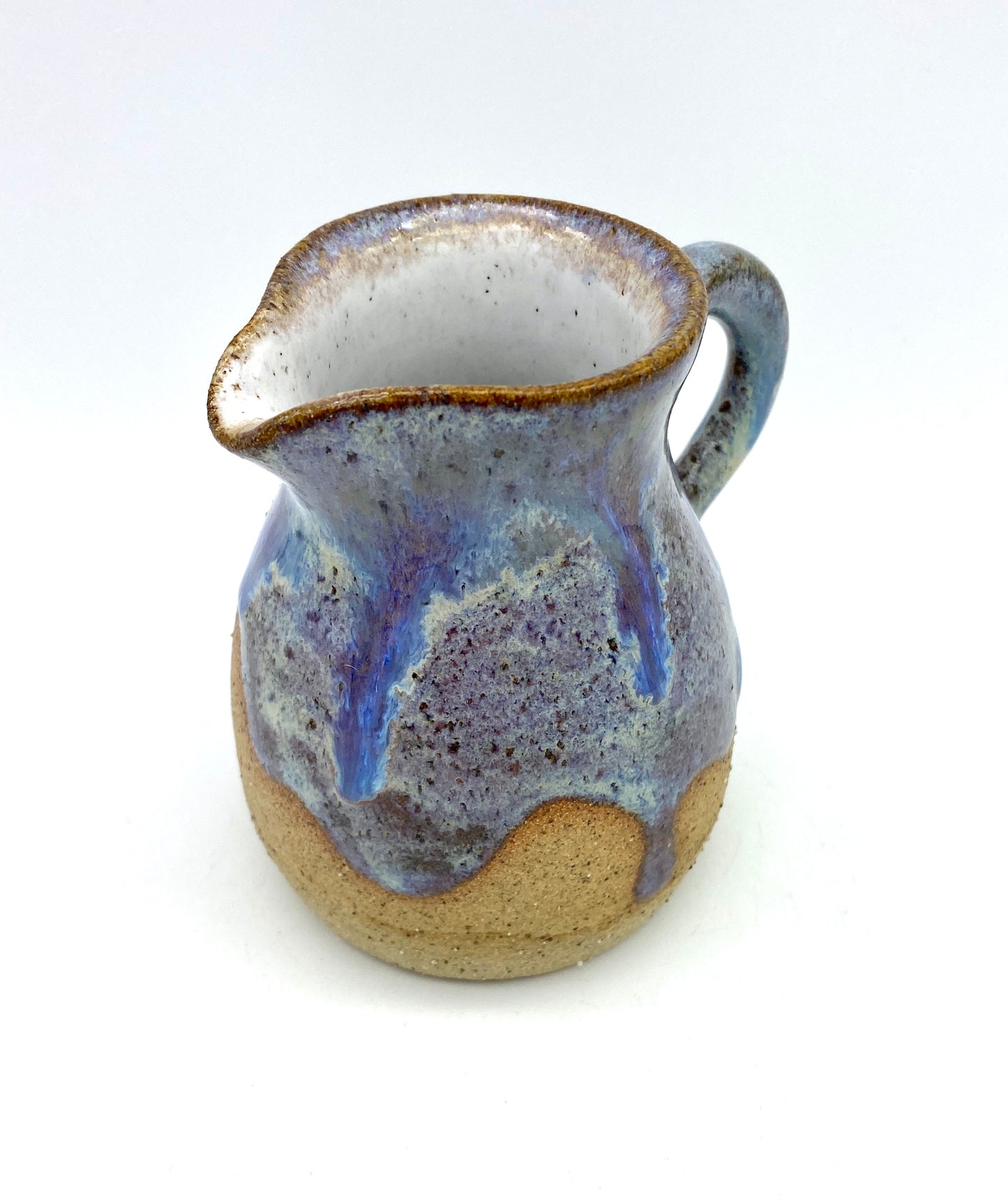 Little jug in purples and toasty clay