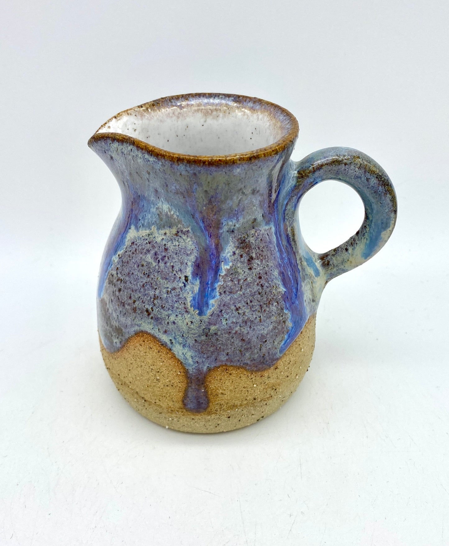 Little jug in purples and toasty clay