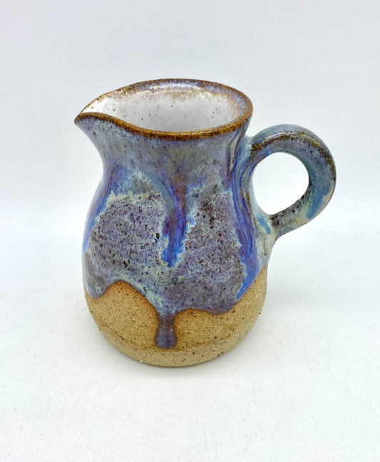 Little jug in purples and toasty clay