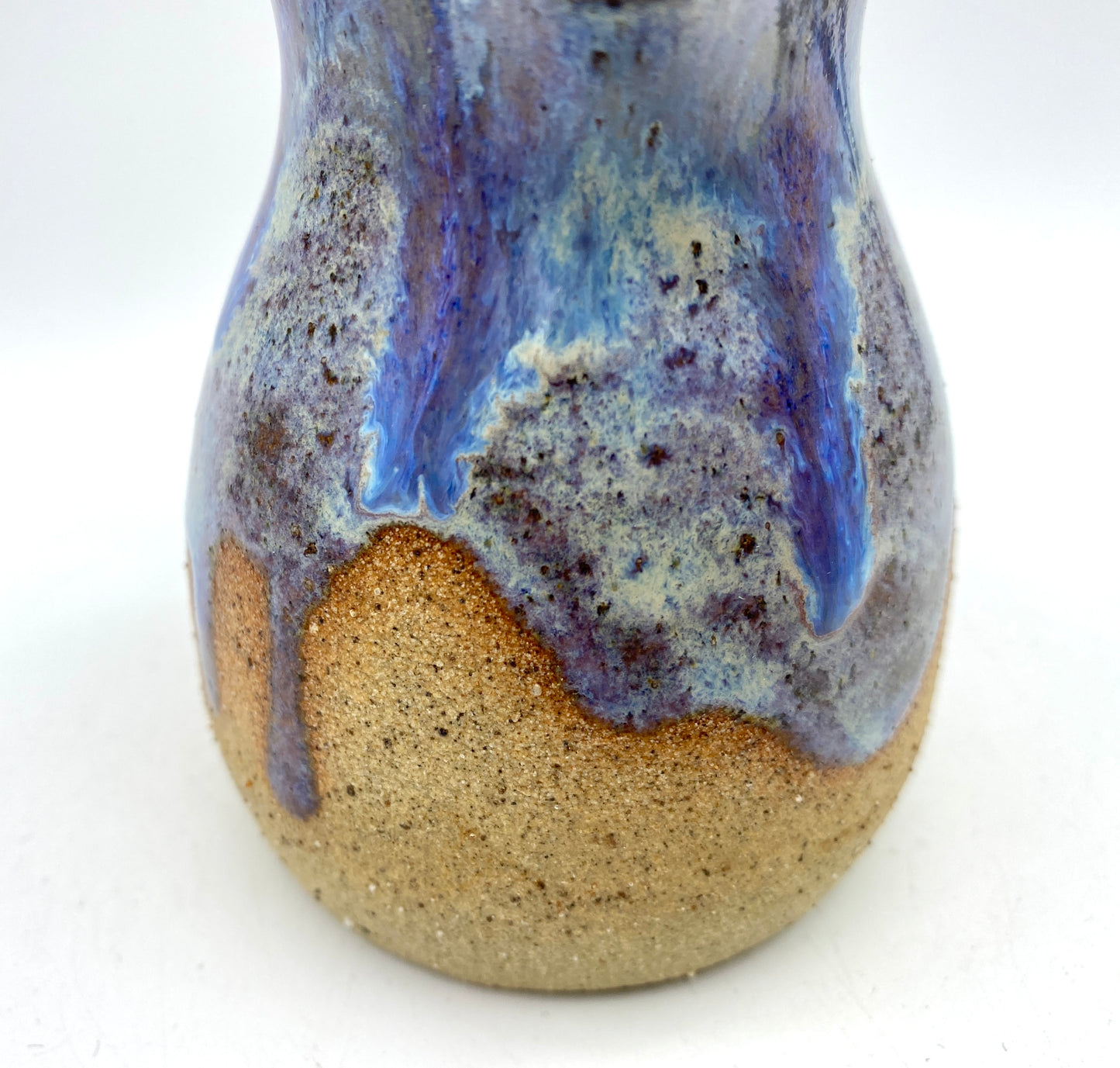 Little jug in purples and toasty clay