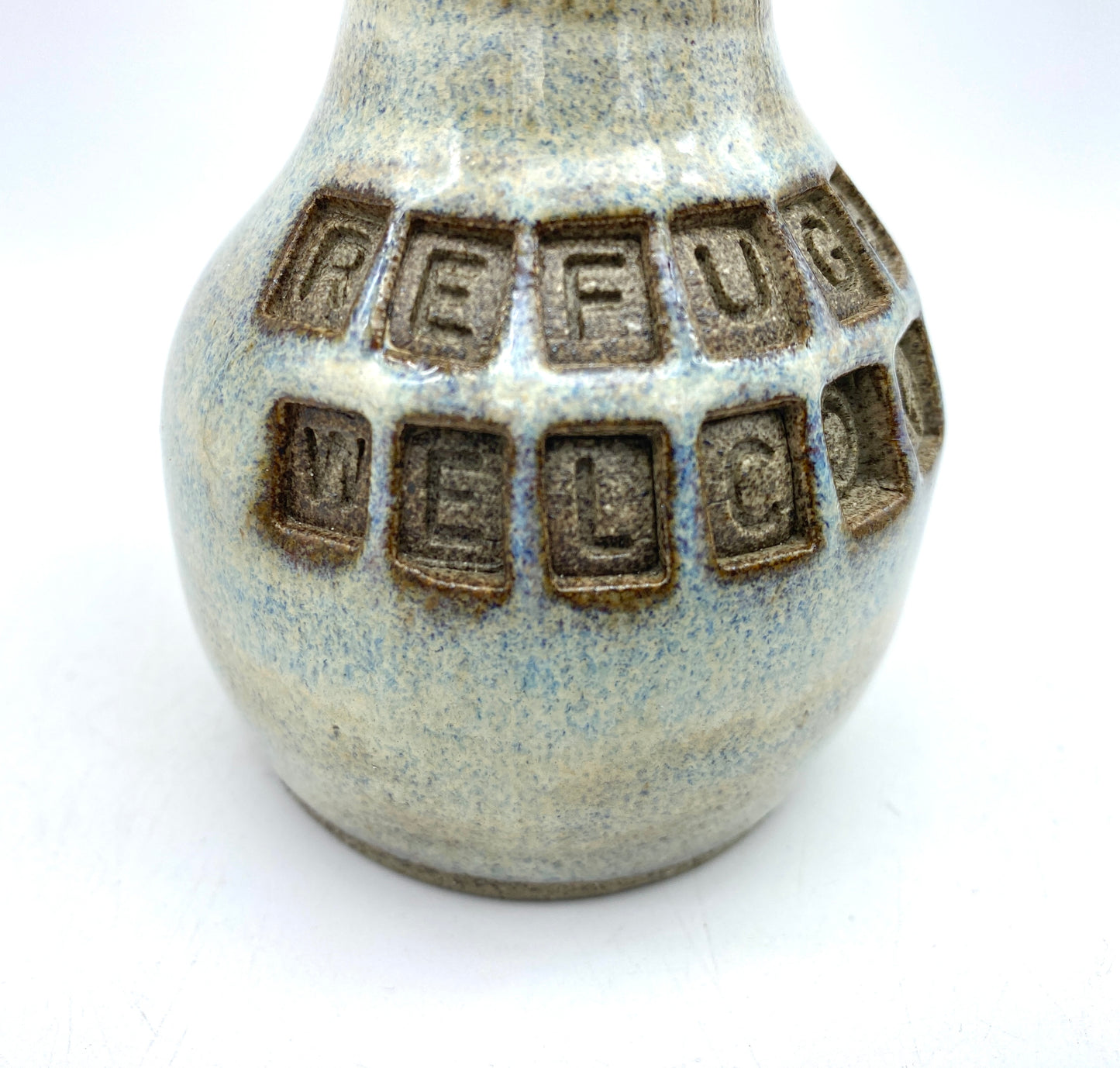 'Refugees welcome' little bud vase in special Scandi clay