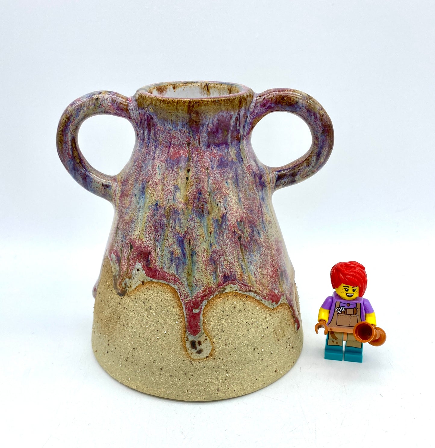 Stunning two-handled vase in toasty clay and purple glazes