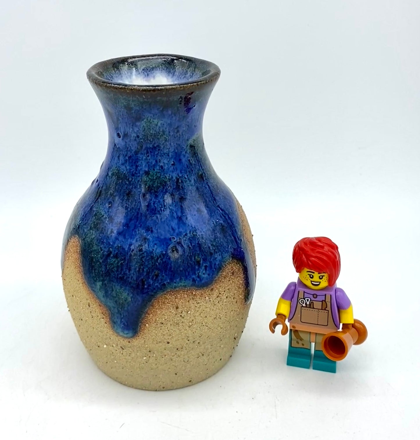 Teeny vase in rich blues and speckled clay