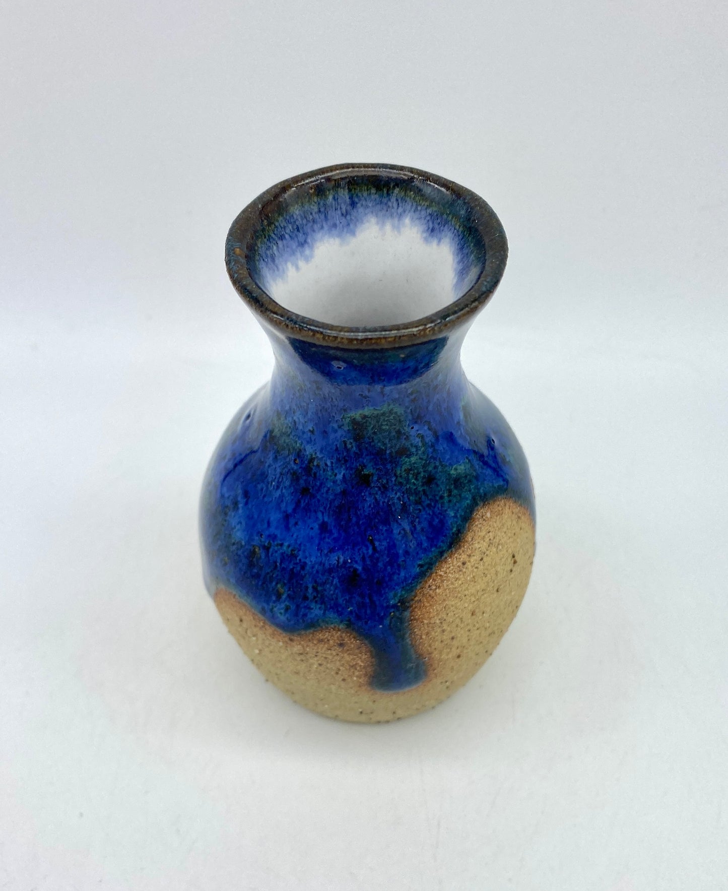 Teeny vase in rich blues and speckled clay