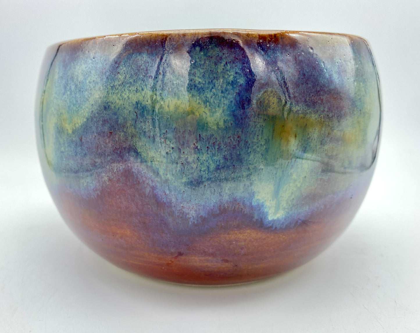 SECOND Small bowl in rich red with overlaid greens and blues