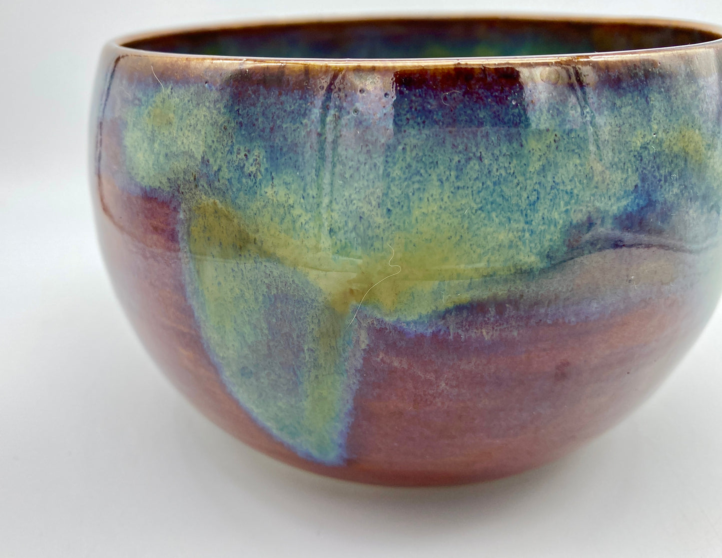 SECOND Small bowl in rich red with overlaid greens and blues