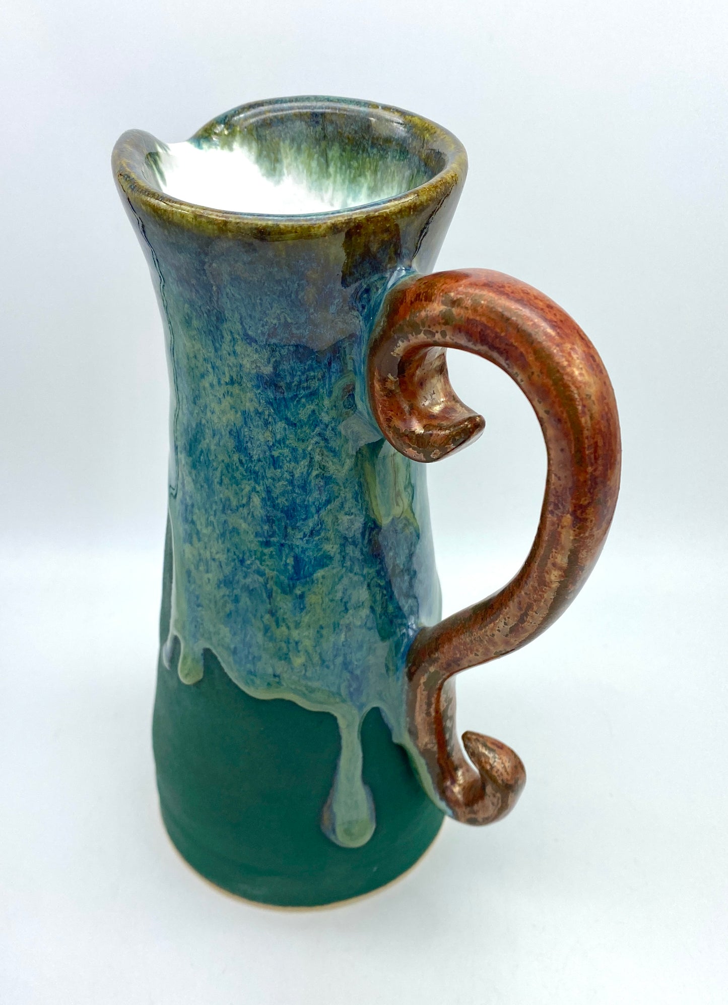 COMMISSION Tall pitcher in greens and copper