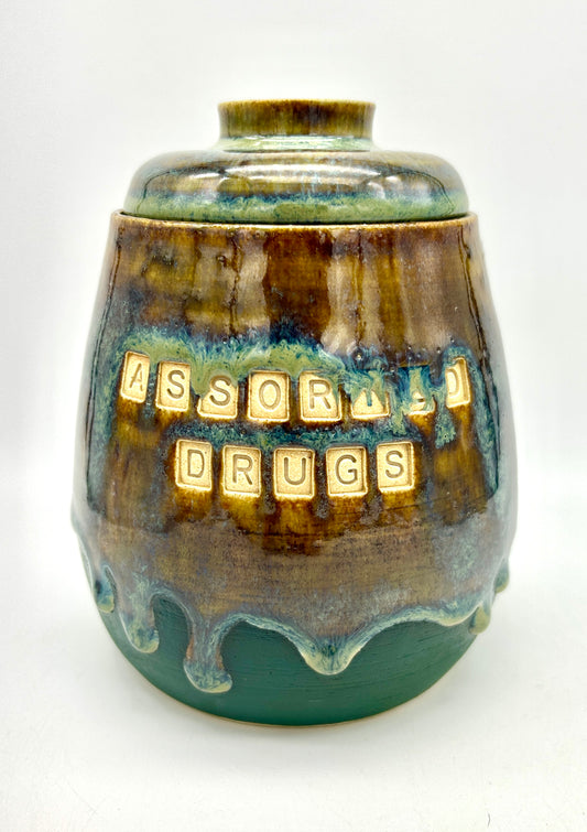 Wonderful 'assorted drugs' lidded jar in flowing greens