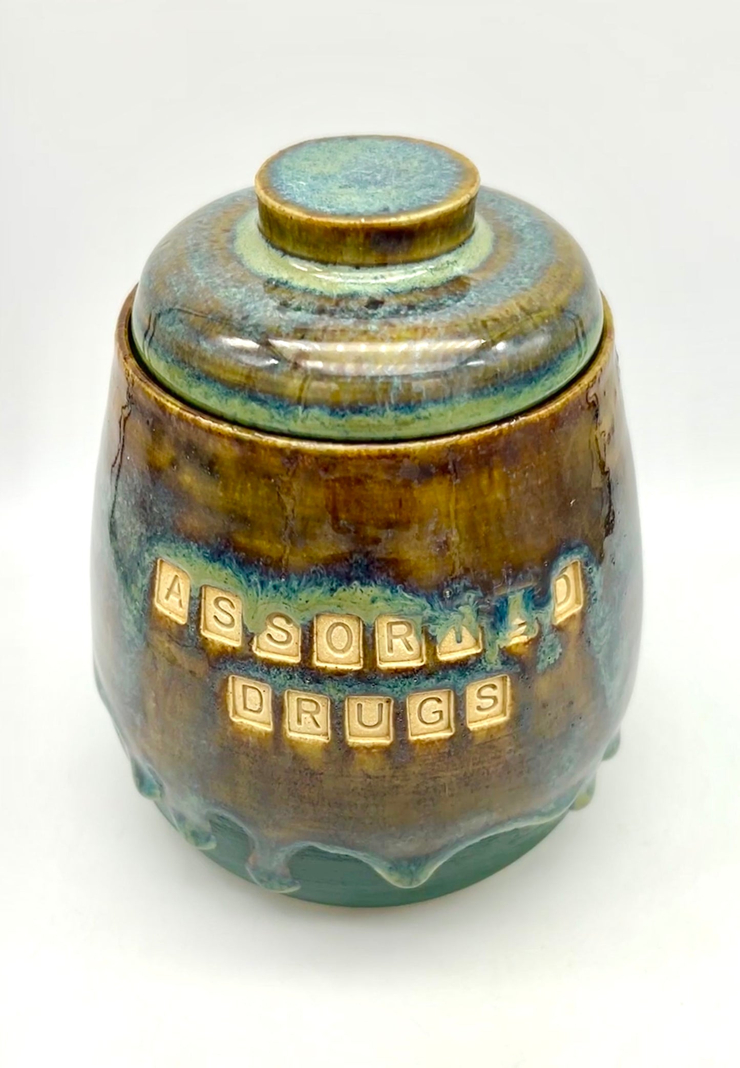 Wonderful 'assorted drugs' lidded jar in flowing greens