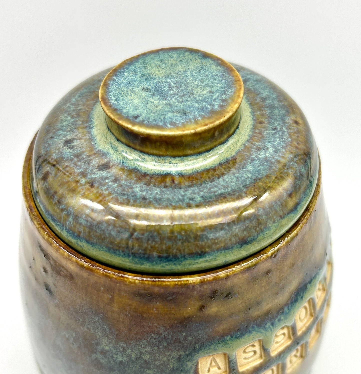 Wonderful 'assorted drugs' lidded jar in flowing greens