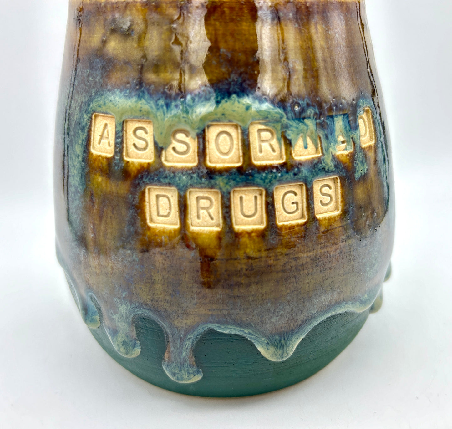 Wonderful 'assorted drugs' lidded jar in flowing greens