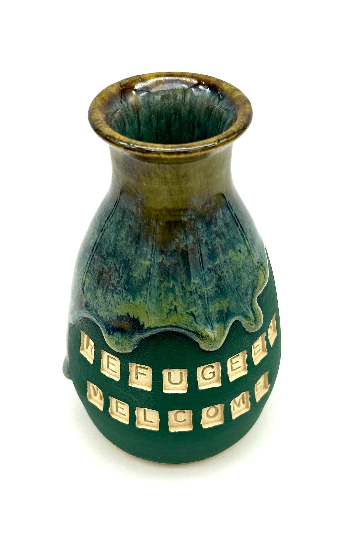 'Refugees welcome' vase in rich green flowing glazes