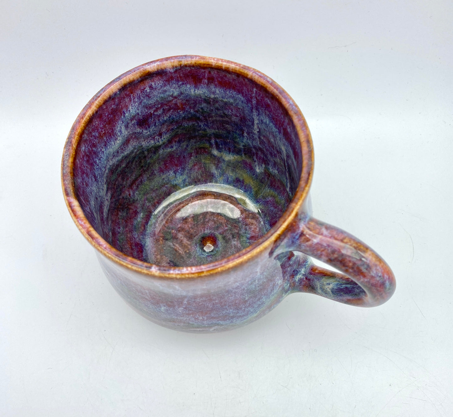 Stunning mug in 'heathery moors' glazes