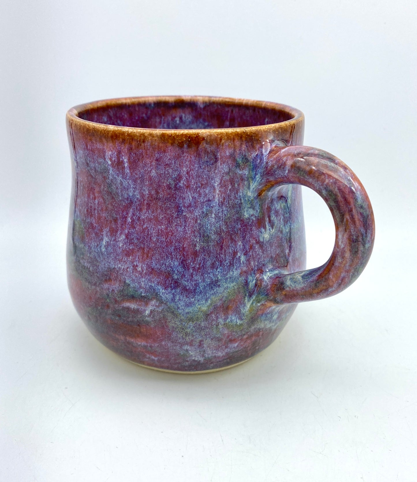 Stunning mug in 'heathery moors' glazes