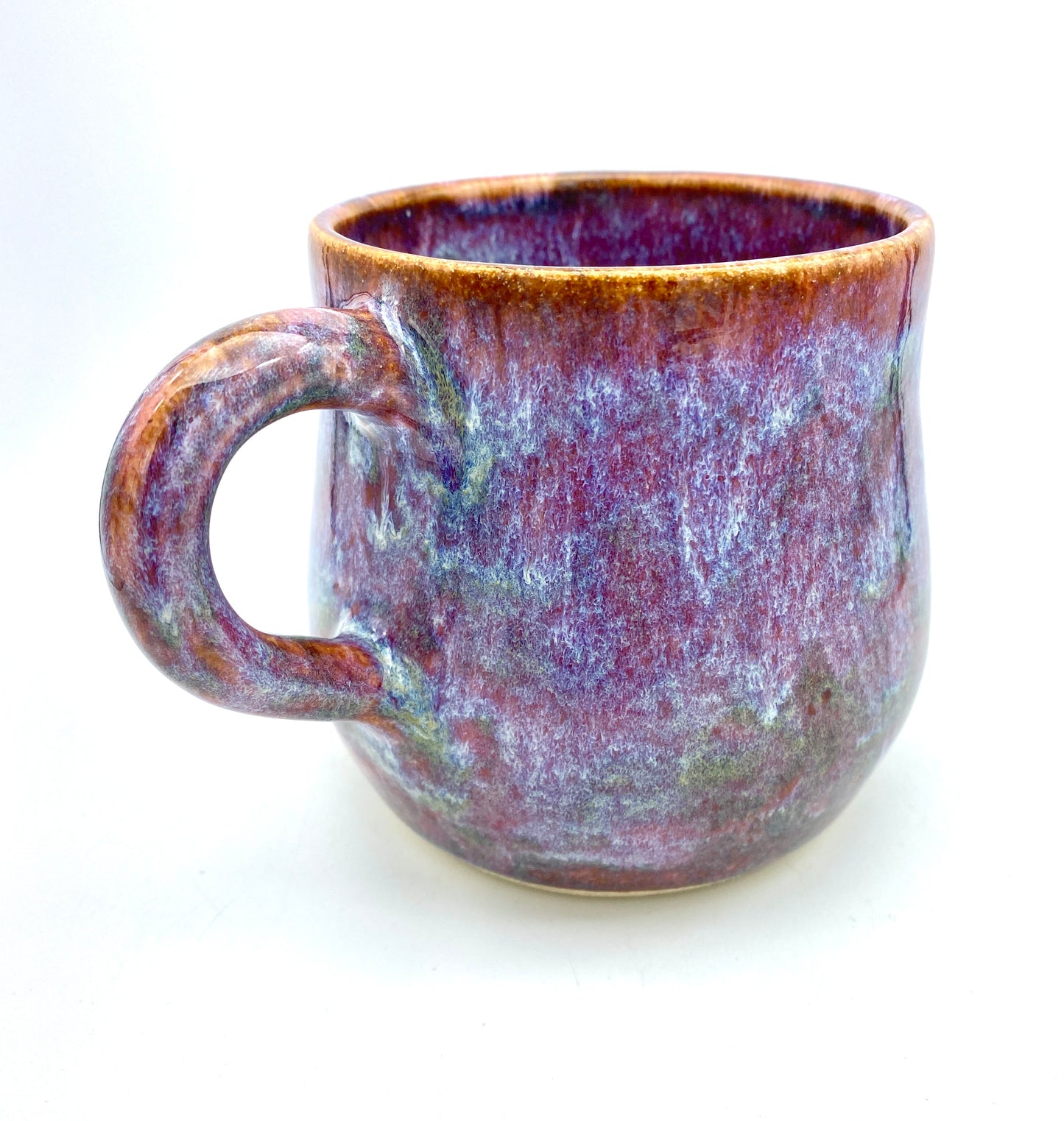 Stunning mug in 'heathery moors' glazes