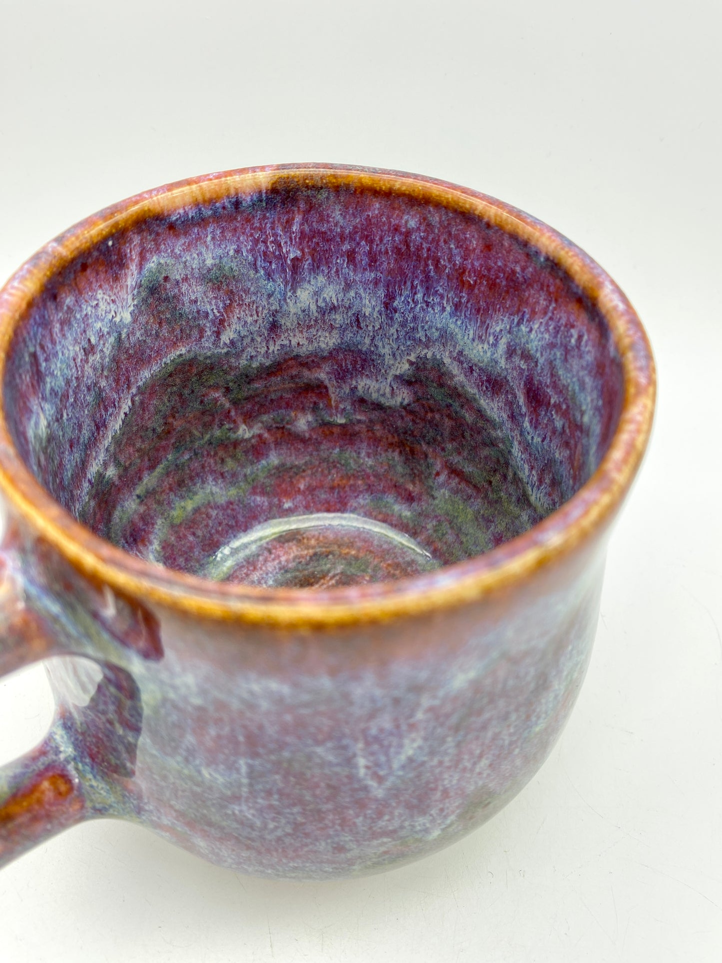 Stunning mug in 'heathery moors' glazes