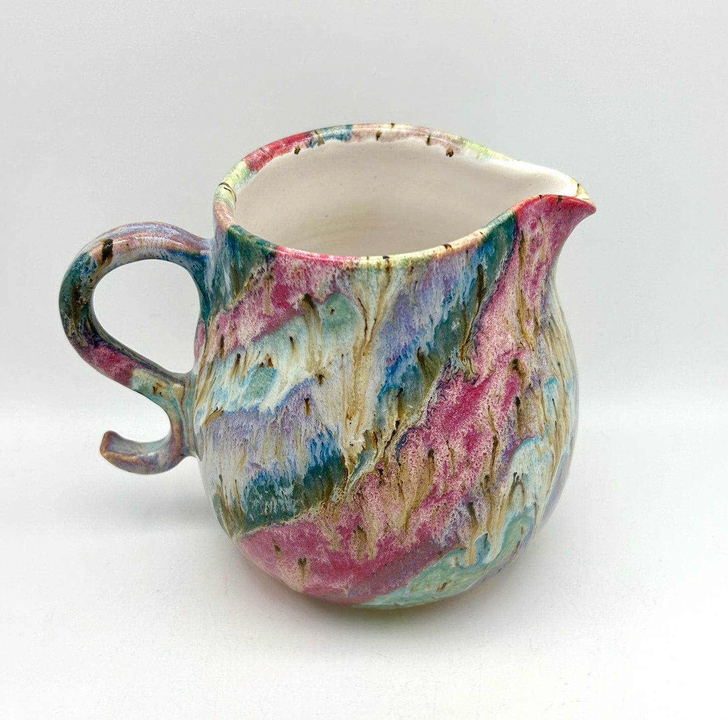 Gorgeous curly jug in my 'aurora' glazes