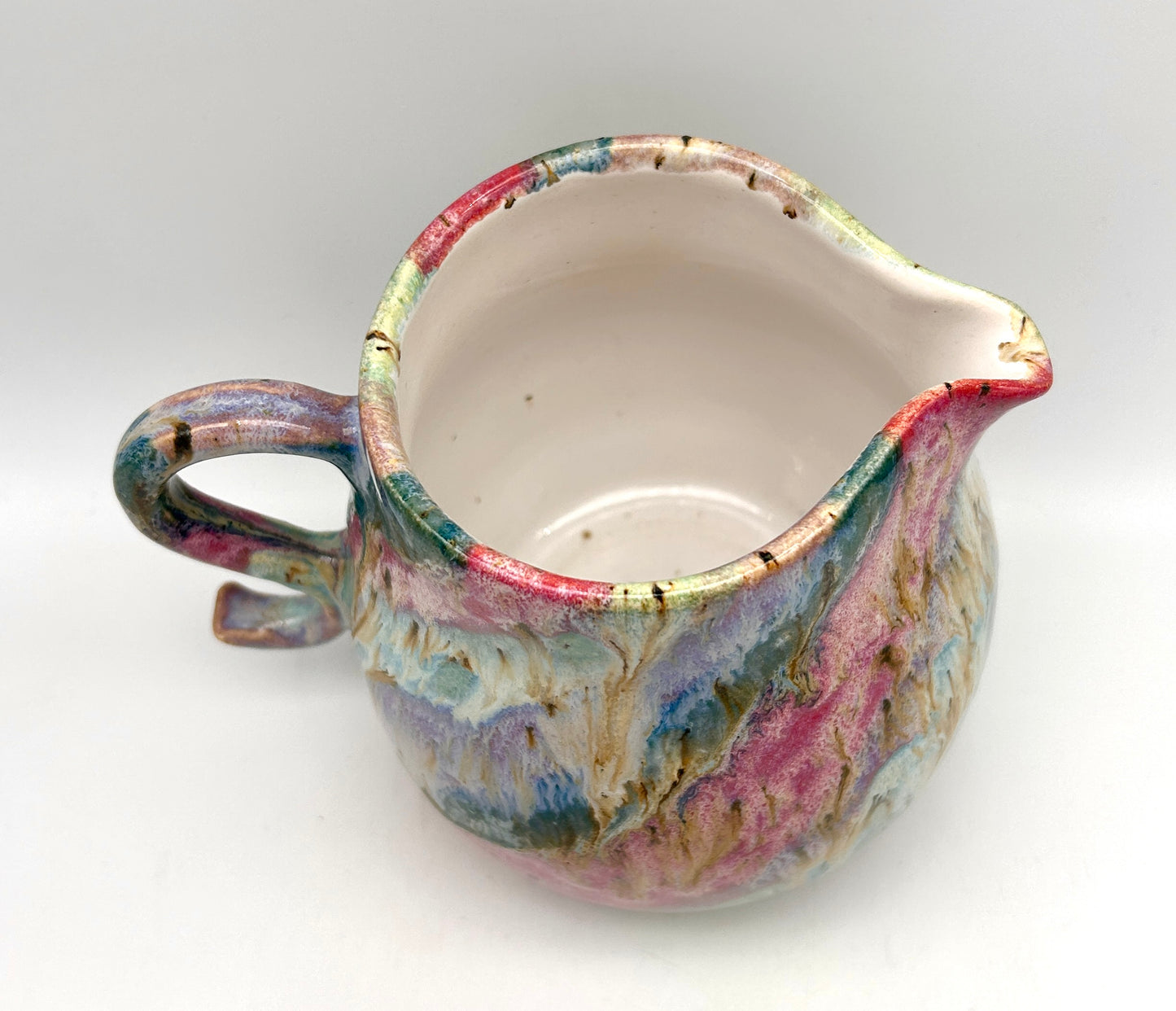 Gorgeous curly jug in my 'aurora' glazes