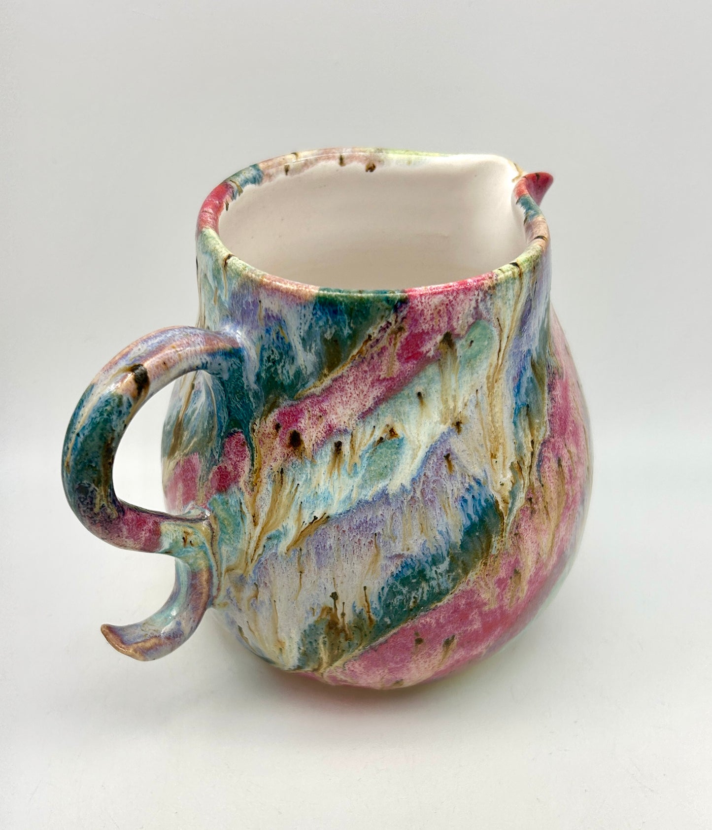 Gorgeous curly jug in my 'aurora' glazes