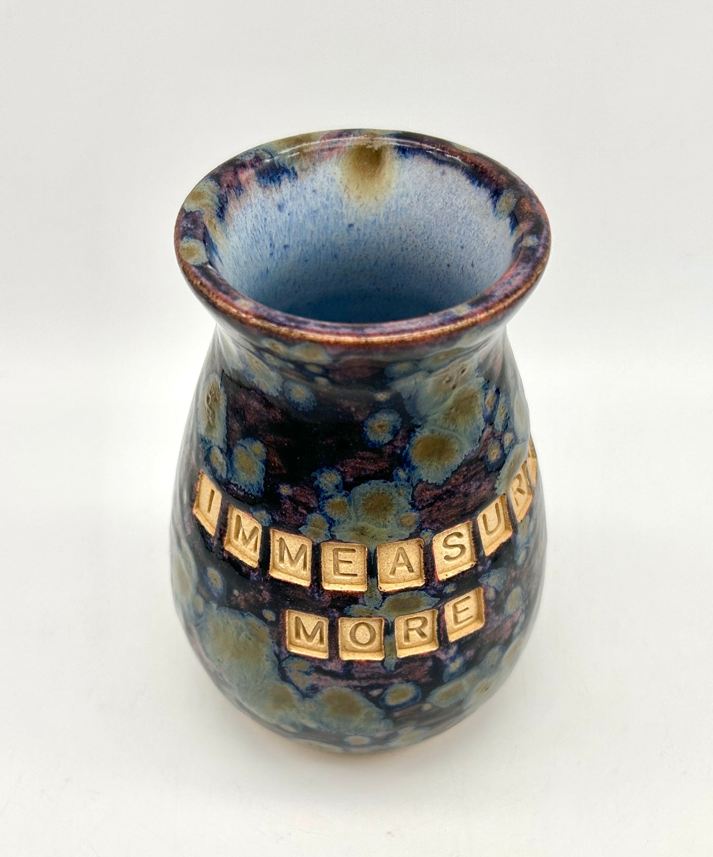 'Immeasurably more' bud vase in galaxy glazes