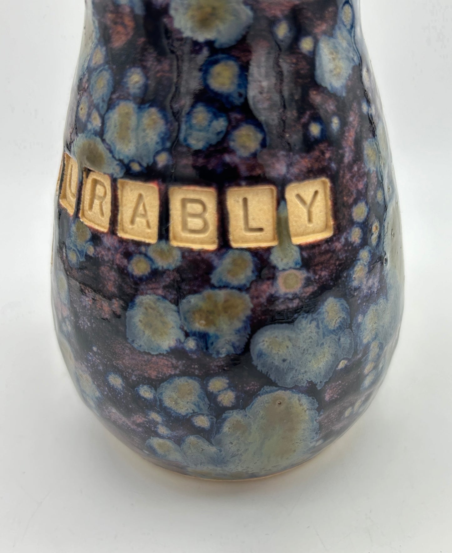 'Immeasurably more' bud vase in galaxy glazes