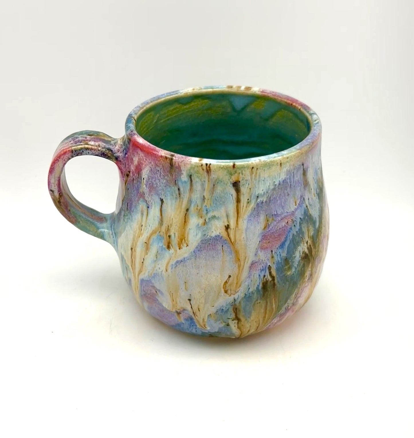 Small mug in my 'aurora' glaze combination