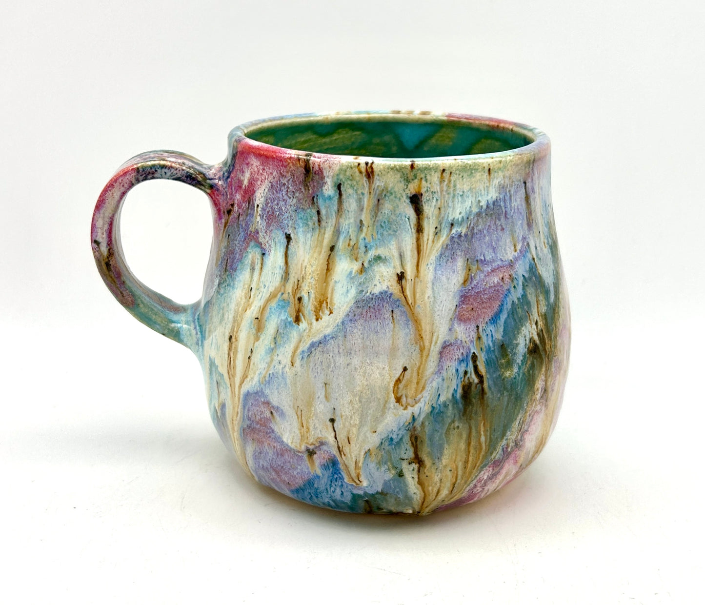 Small mug in my 'aurora' glaze combination