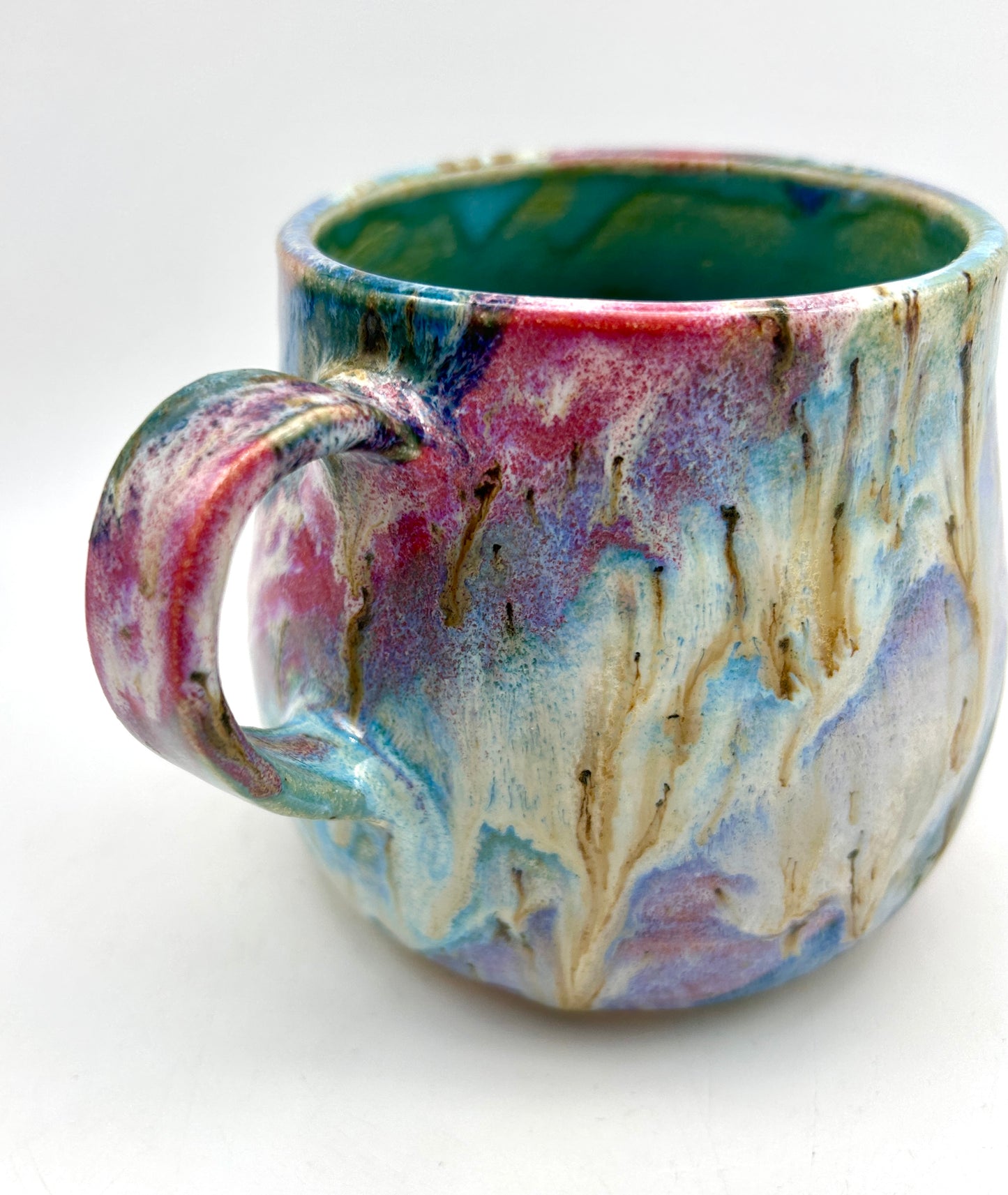 Small mug in my 'aurora' glaze combination