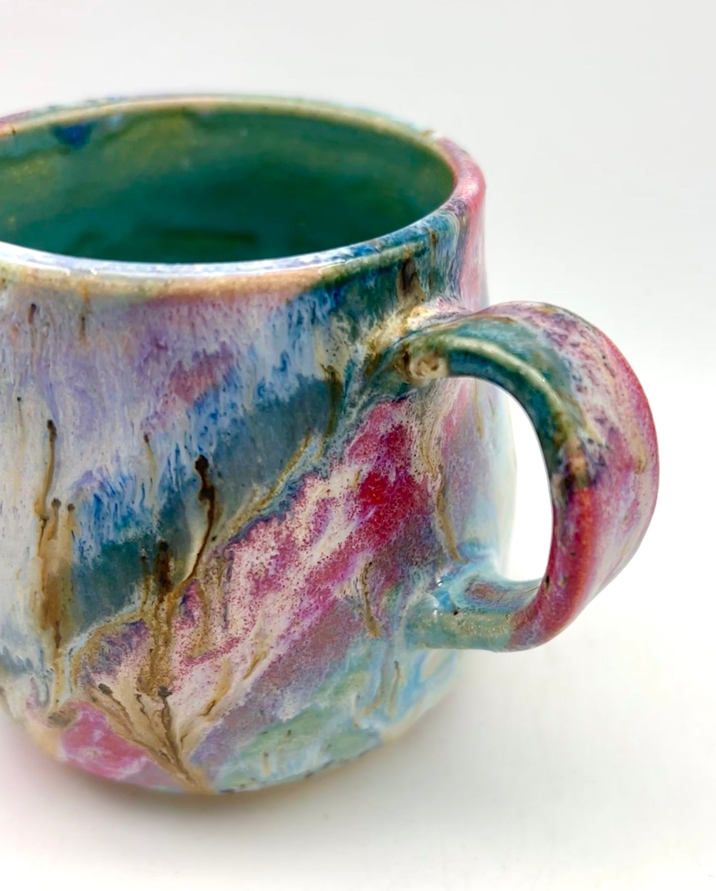 Small mug in my 'aurora' glaze combination