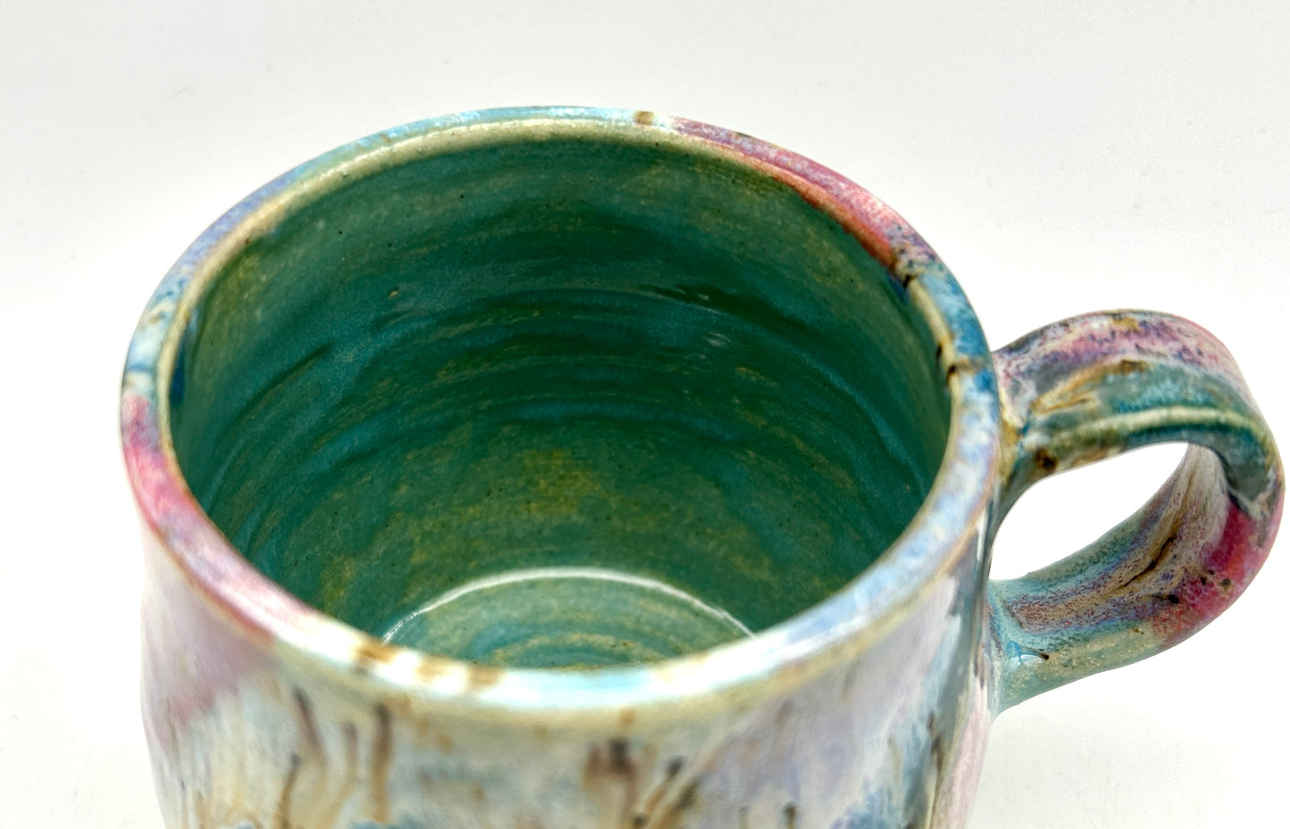 Small mug in my 'aurora' glaze combination