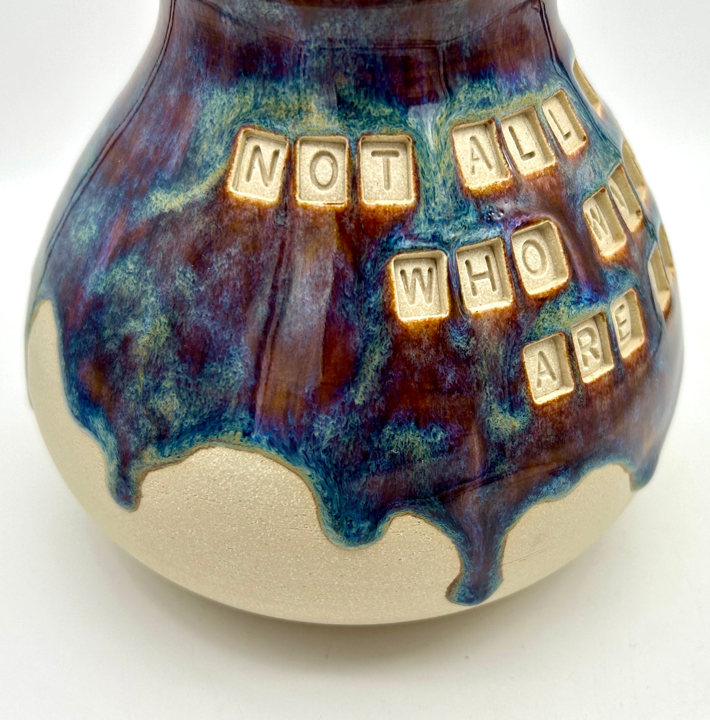 'Not all those who wander are lost' plump vase in 'heathery moors' glazes