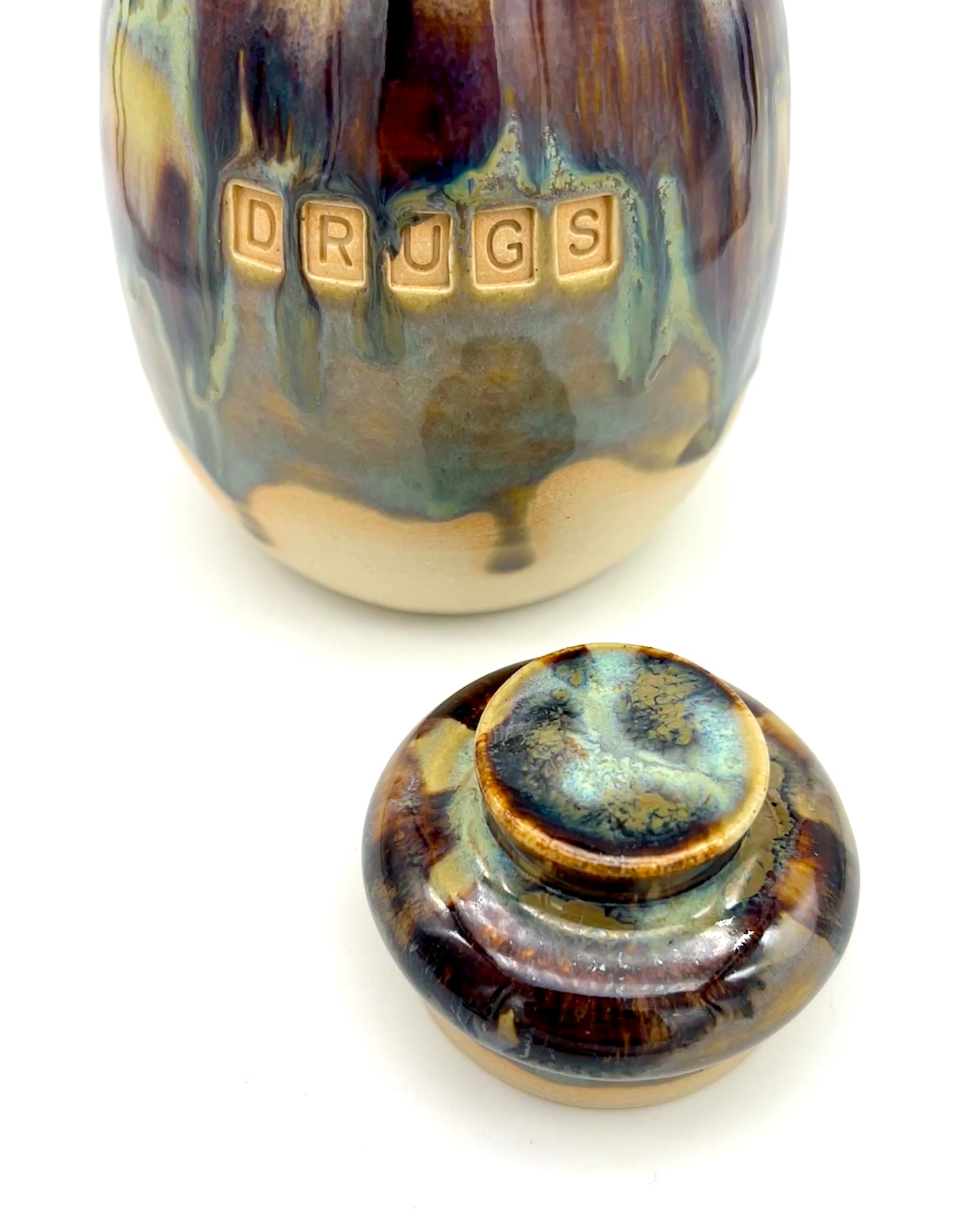 'Drugs' lidded pot in flowing 'aqua falls' glazes