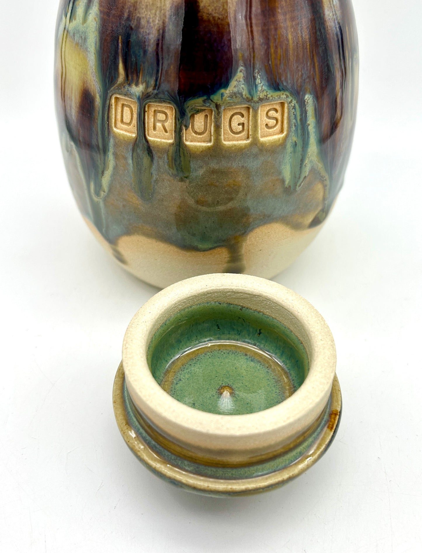 'Drugs' lidded pot in flowing 'aqua falls' glazes