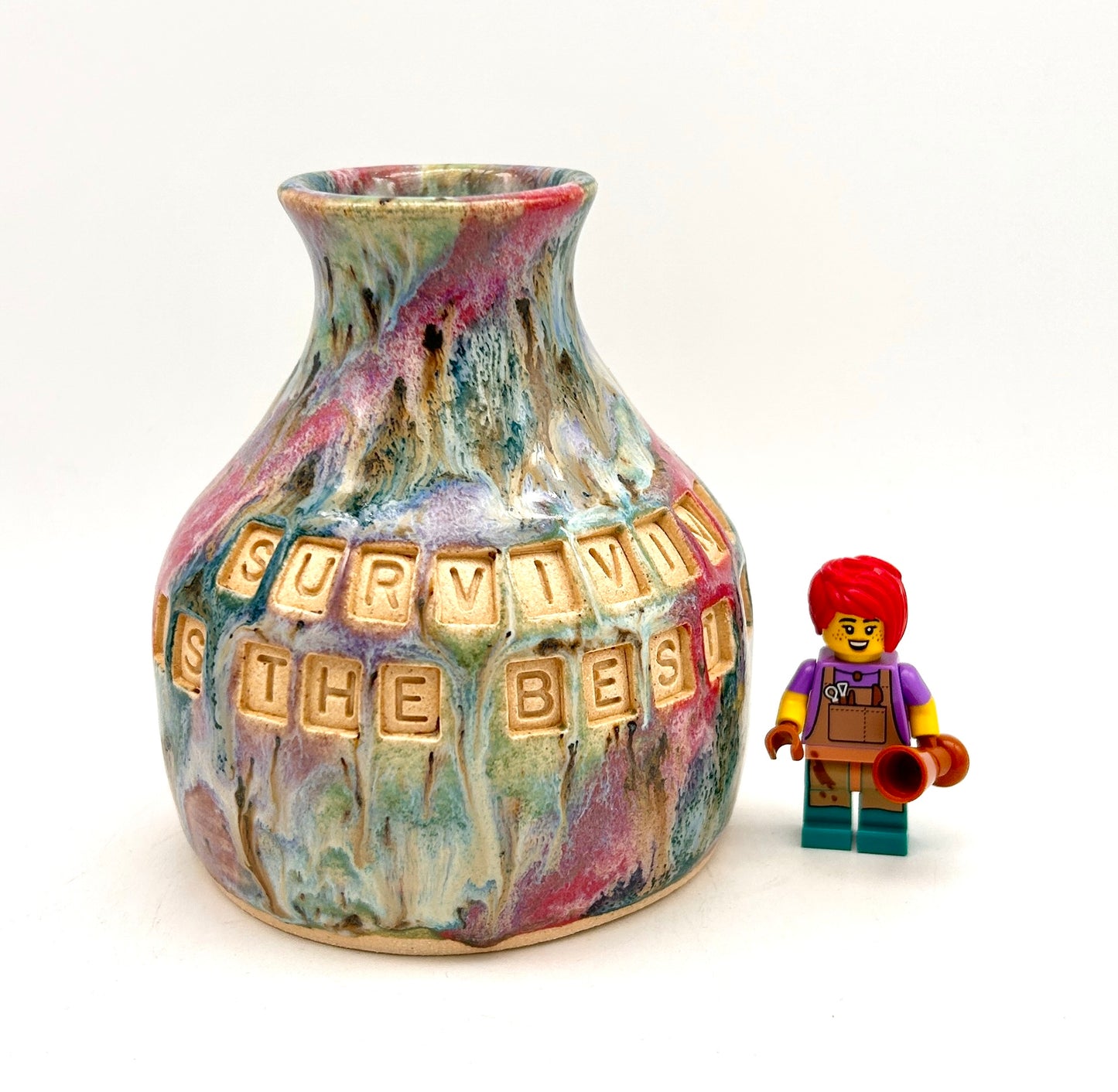 'Surviving is the best revenge' bud vase in my 'aurora' glaze combination