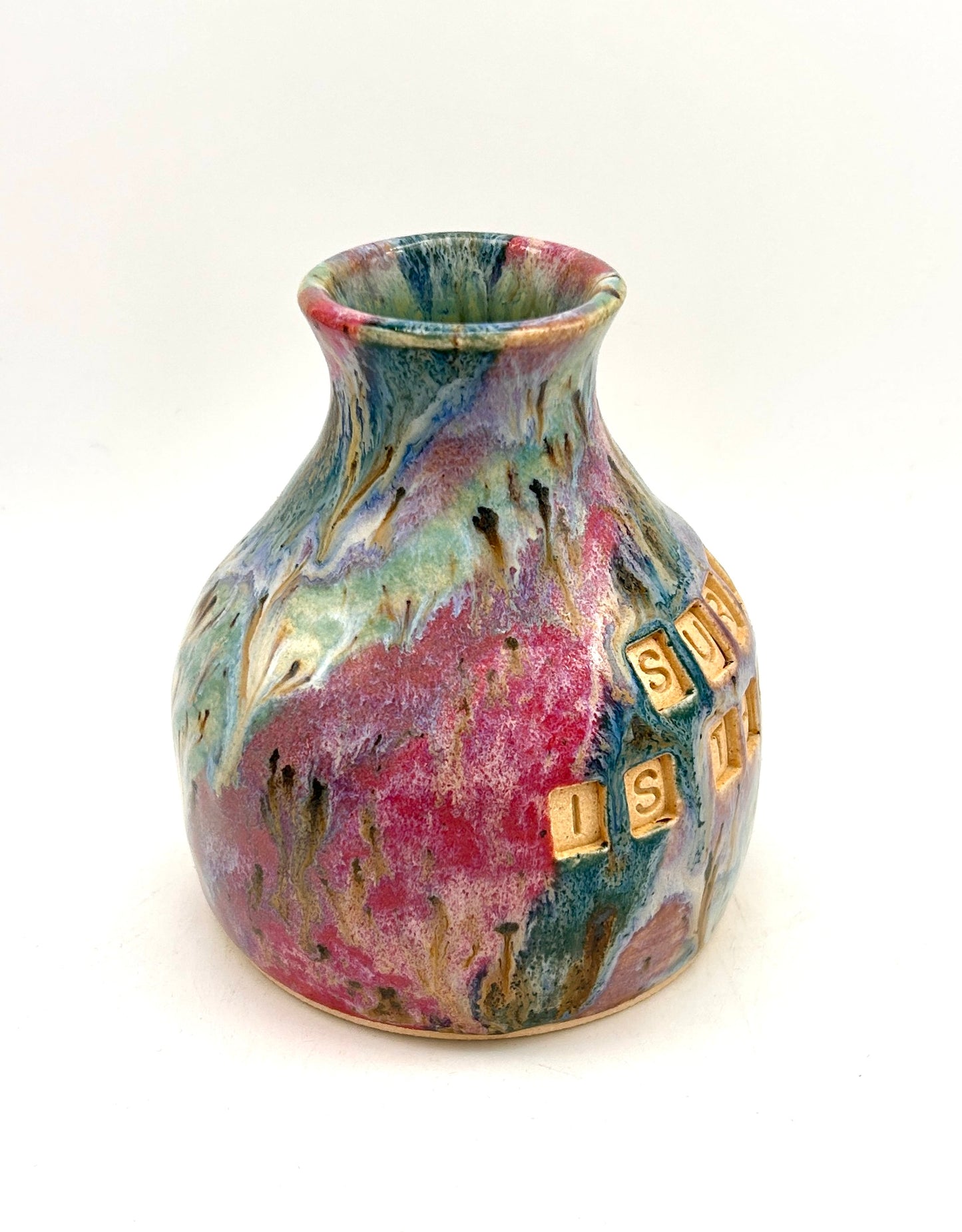 'Surviving is the best revenge' bud vase in my 'aurora' glaze combination