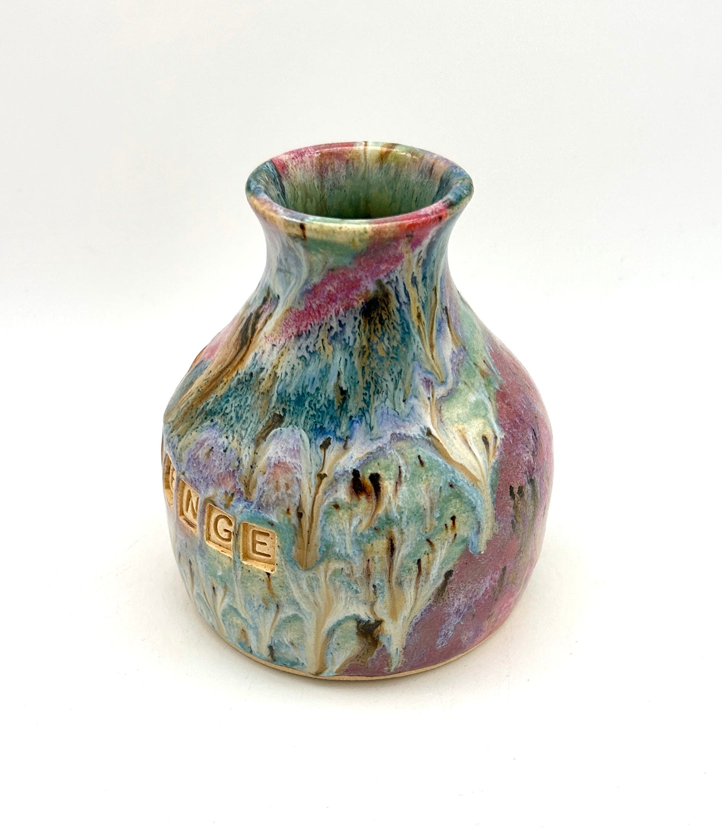 'Surviving is the best revenge' bud vase in my 'aurora' glaze combination