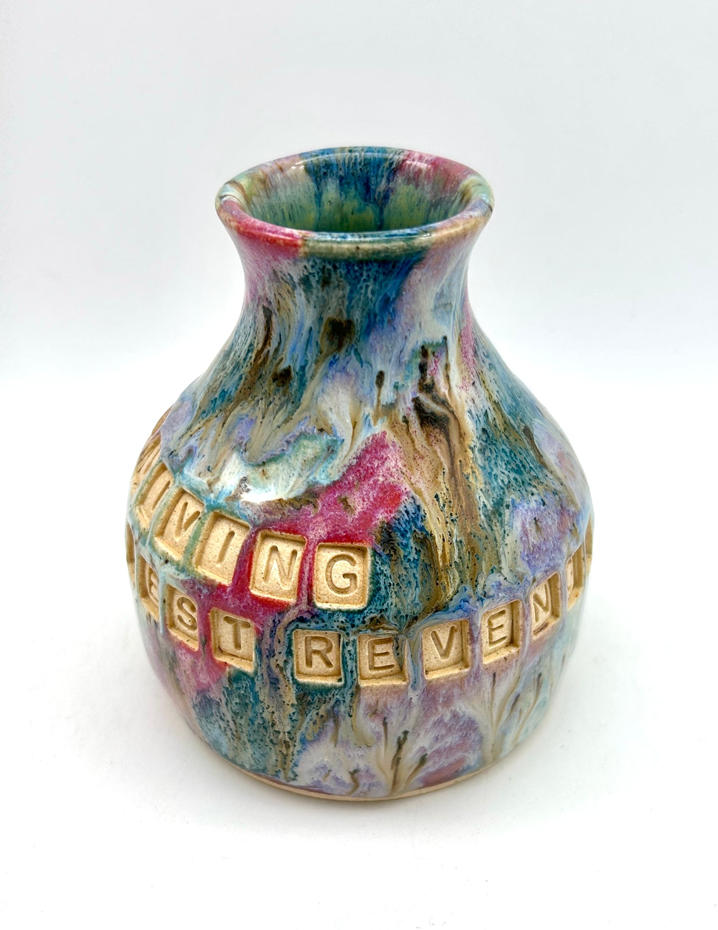 'Surviving is the best revenge' bud vase in my 'aurora' glaze combination