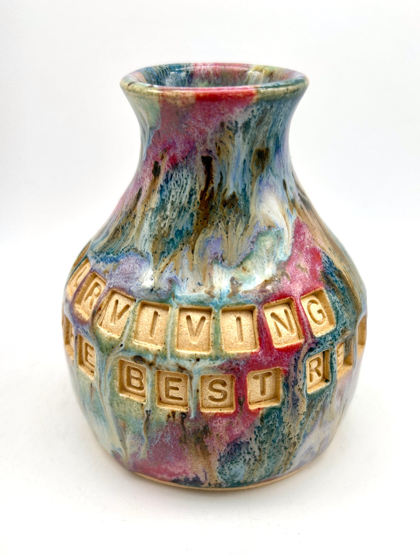 'Surviving is the best revenge' bud vase in my 'aurora' glaze combination