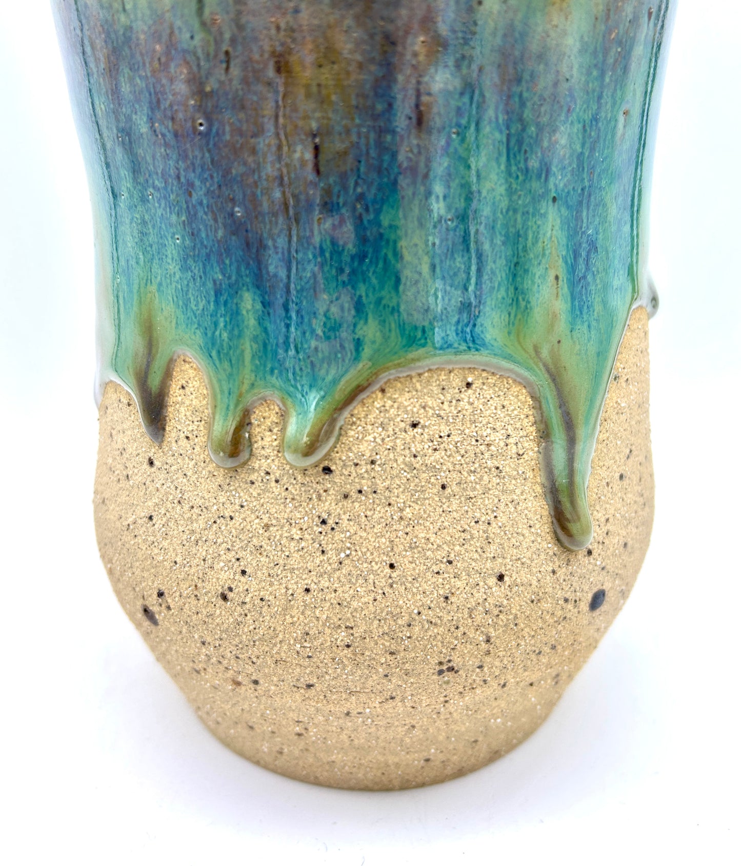 Tall 'drugs' jar in toasty clay glazed in flowing greens