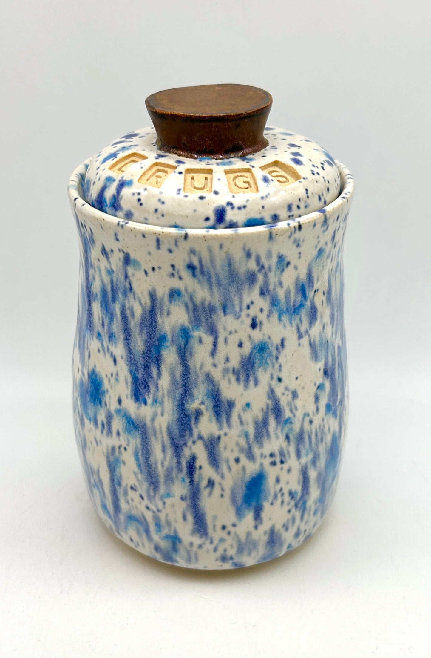 Small 'drugs' lidded jar in speckled blues