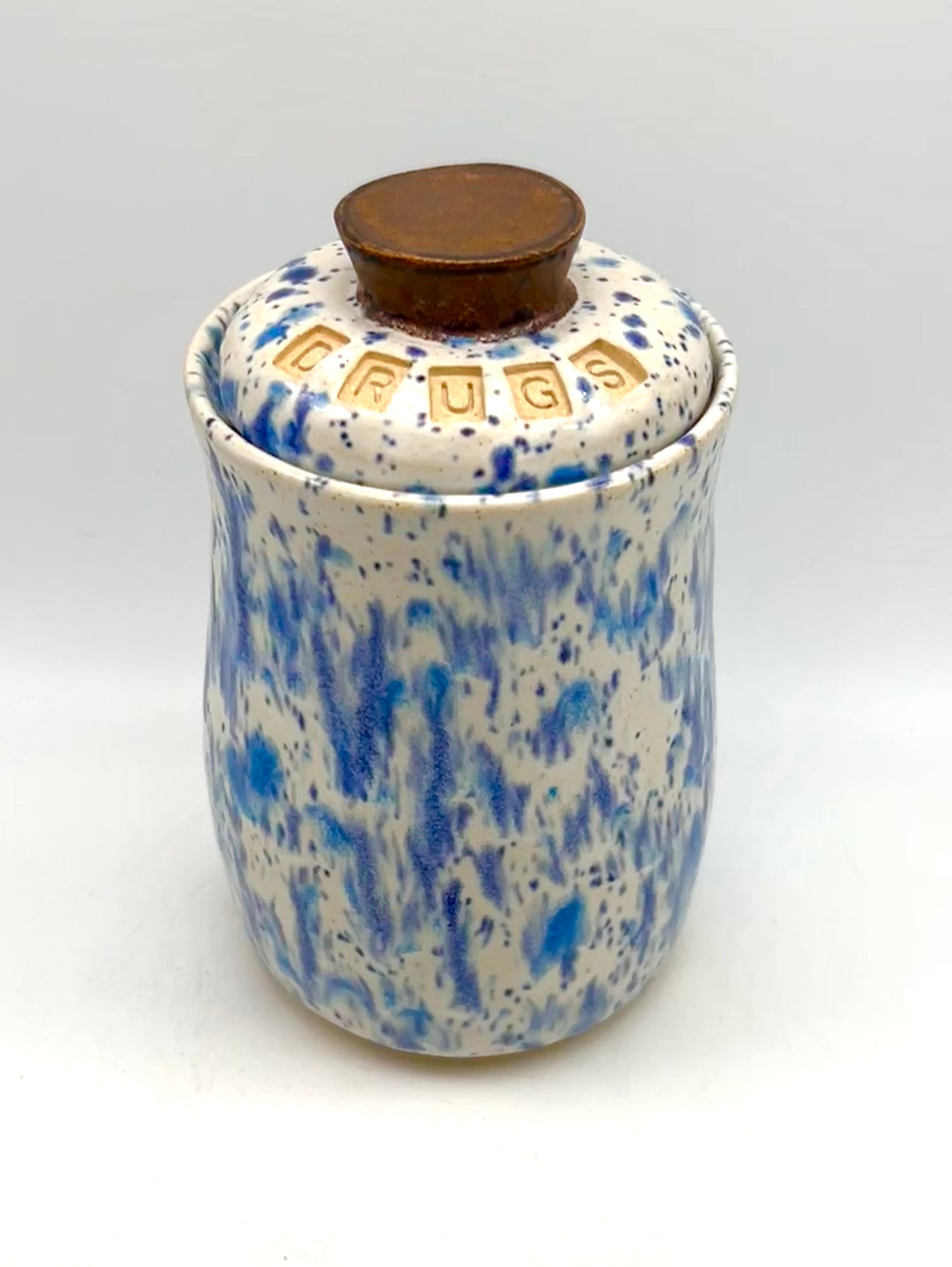 Small 'drugs' lidded jar in speckled blues