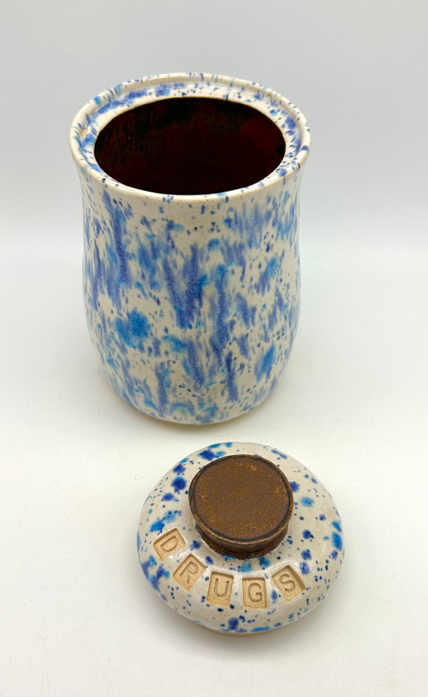 Small 'drugs' lidded jar in speckled blues