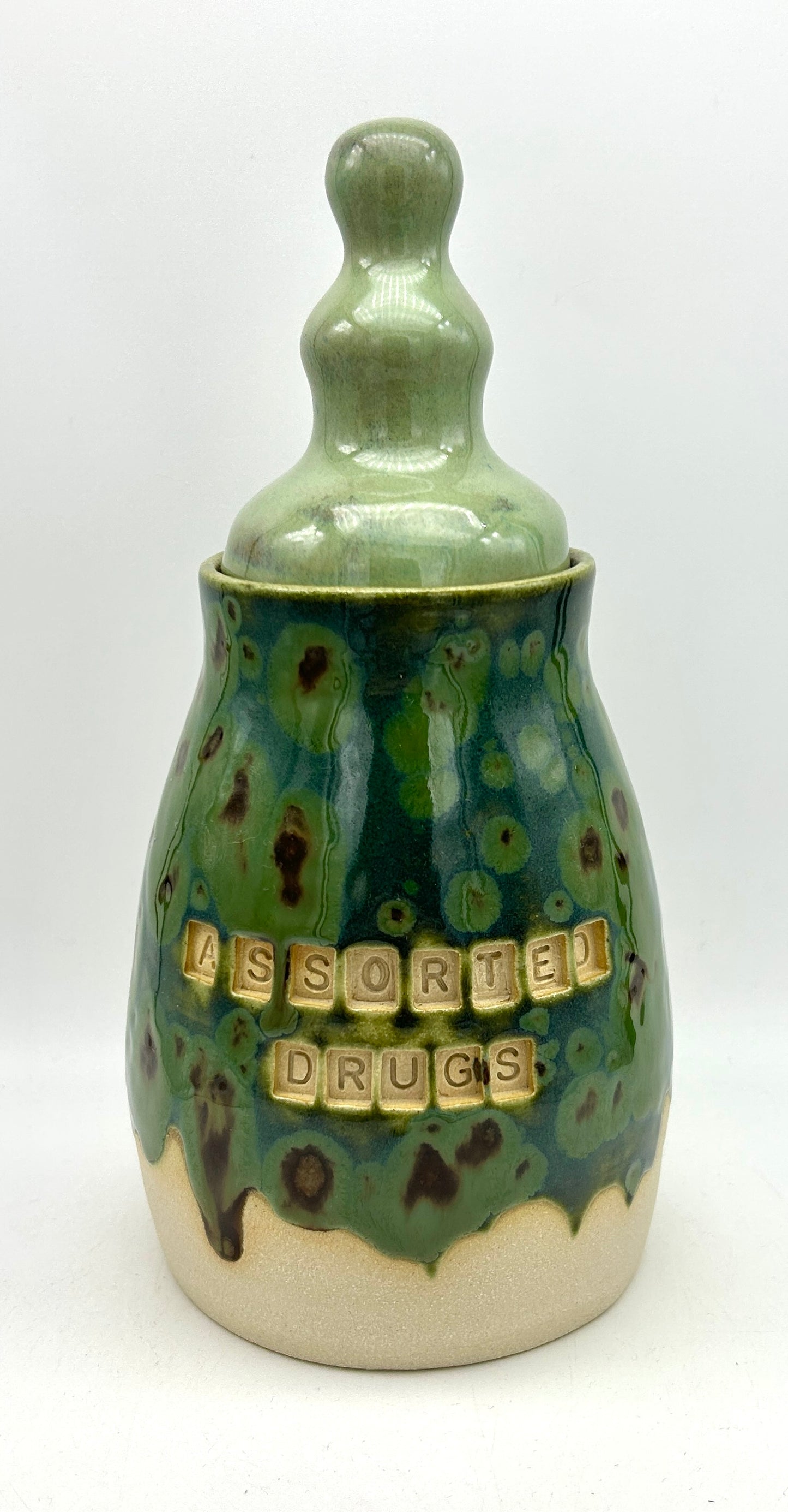 Tall 'assorted drugs' jar with fancy lid