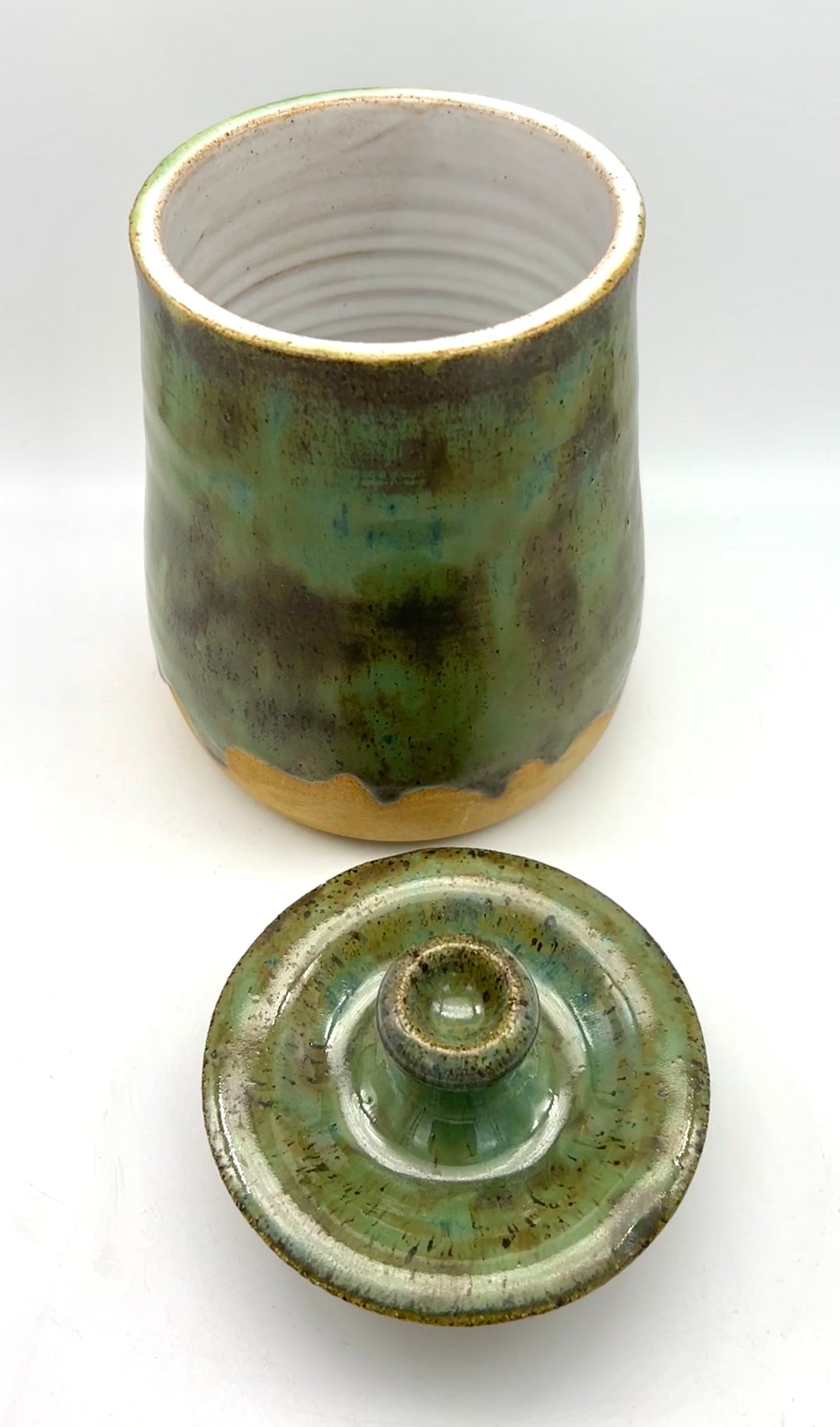 SECOND Tall lidded pot in toasty clay with green glazes