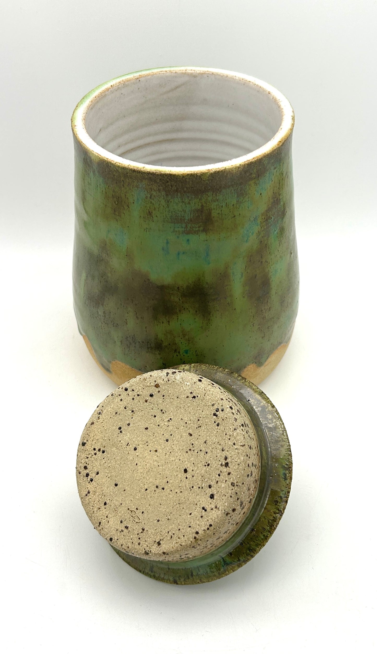 SECOND Tall lidded pot in toasty clay with green glazes