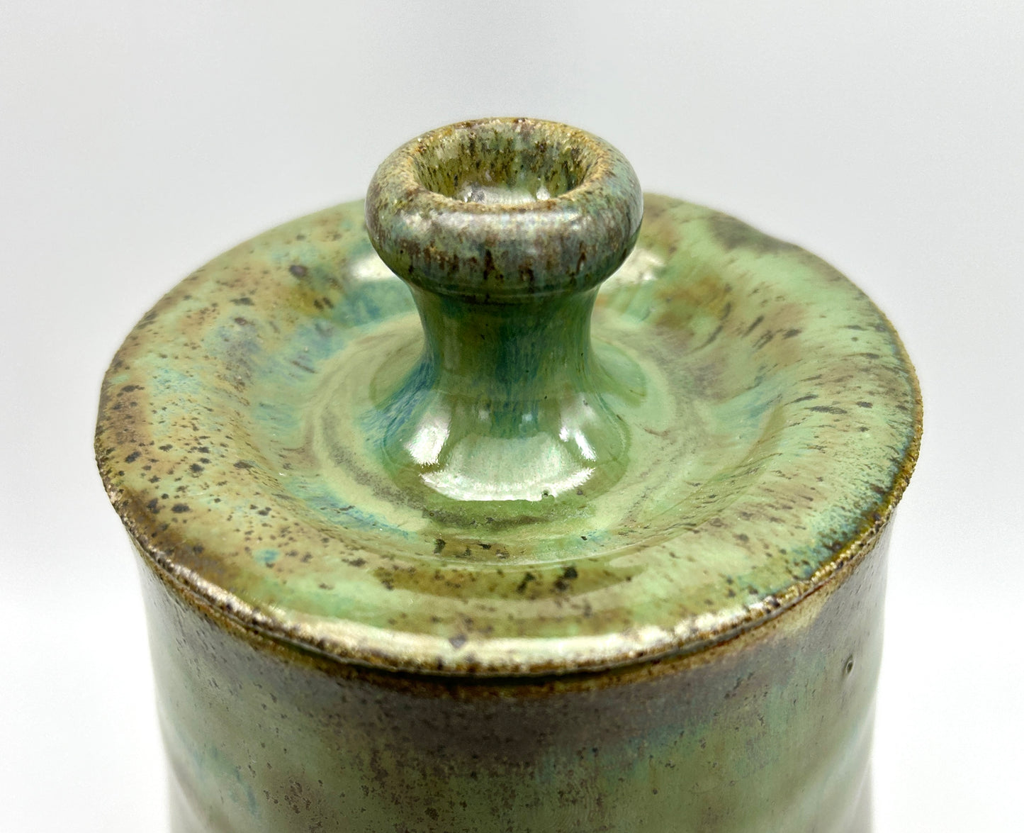 SECOND Tall lidded pot in toasty clay with green glazes