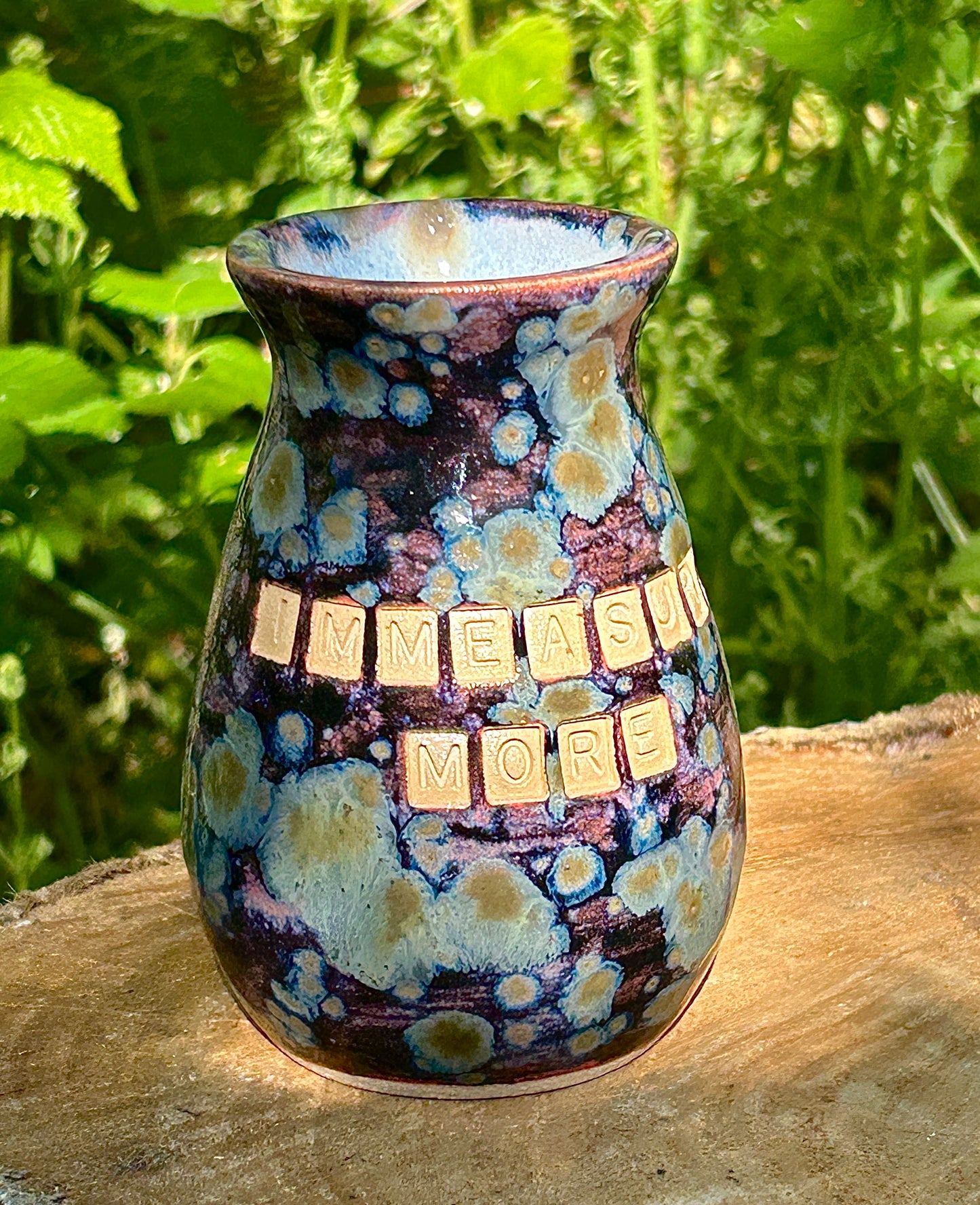 'Immeasurably more' bud vase in galaxy glazes