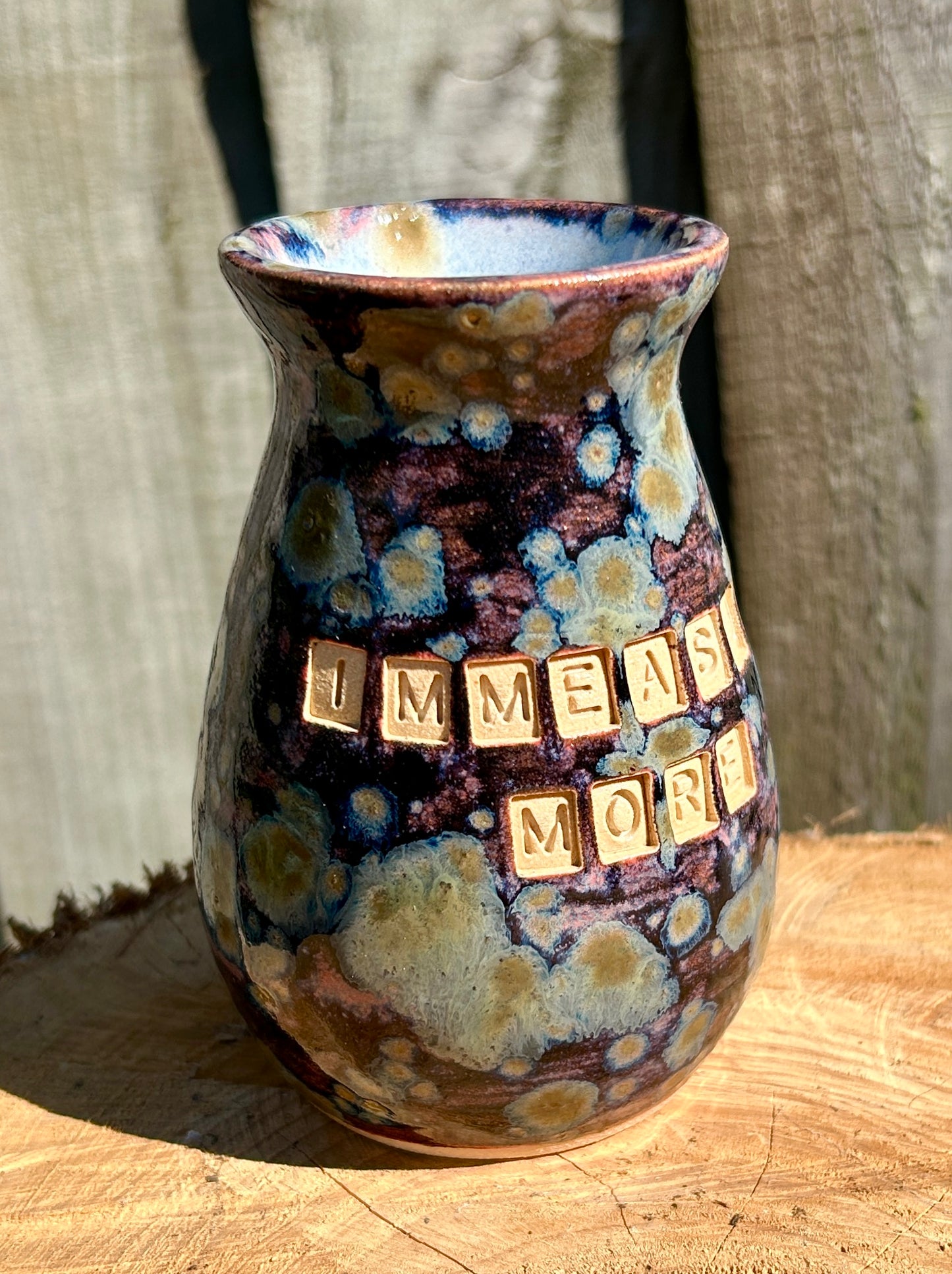 'Immeasurably more' bud vase in galaxy glazes