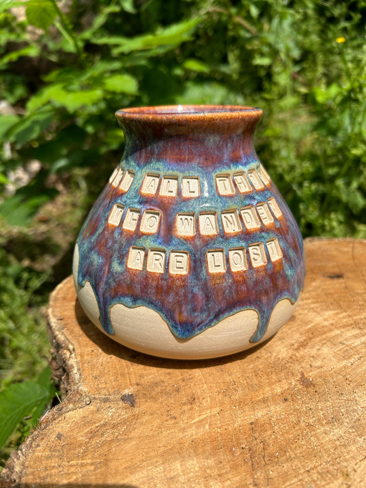 'Not all those who wander are lost' plump vase in 'heathery moors' glazes